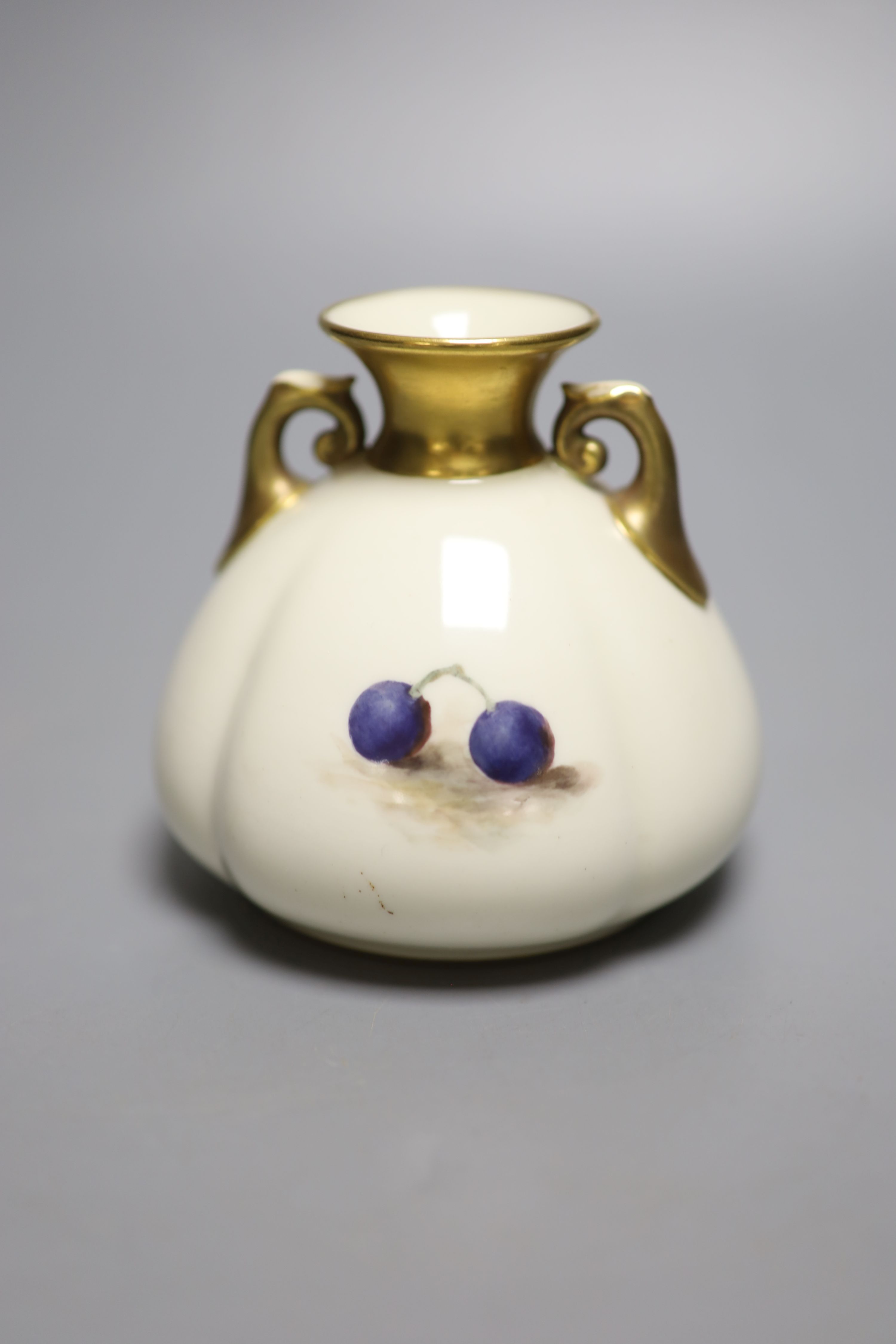 A Royal Worcester two handled vase, painted with fruit and berries by W. Bee, signed, date mark 1926